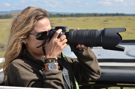 woman photographer in the African savannah の写真素材