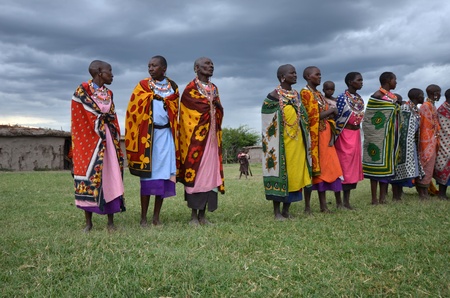 Masai Mara,Kenya ,October 17, 2011: Masai women  dancing  traditional  cultural ceremony near to Masai Mara National Park Reserve,Kenyaのeditorial素材