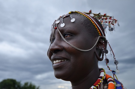 Masai Mara,Kenya, October 17, 2011:Masai woman with traditional clothes in a small villages in the Masai Maraのeditorial素材