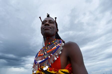 Masai Mara,Kenya, October 17, 2011:Masai man with traditional clothes in a small villages in the Masai Maraのeditorial素材