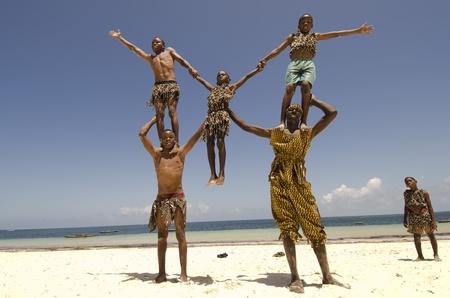Malindi, Kenya-October 21: A group of young acrobats performs on the beach, October 21, 2011 in Malindi, Kenya のeditorial素材