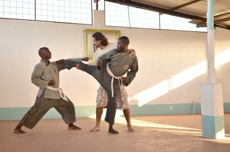 Malindi ,Kenya-October 20,2011:men train in a gym of Vo Vietnam.This gym has been created by an Italian Franco Oriot teacher. The annual registration is of 3 shillings a month のeditorial素材
