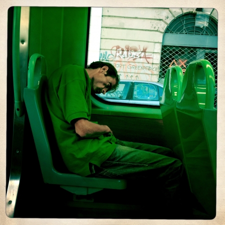 Milan, Italy,13 September 2012 : poor man in a modern streetcar in Milan. In Italy people's percentage to risk of poverty is of 25%.のeditorial素材