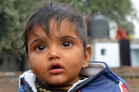 New Delhi,India-February 4, 2013:An unidentified child lives in the slums of New Delhiのeditorial素材