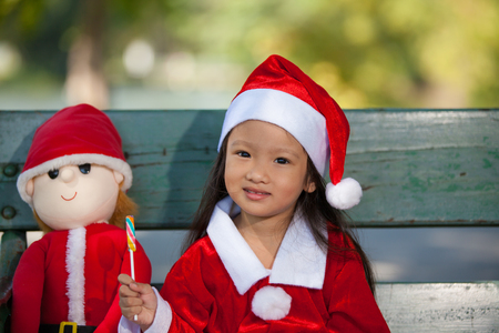 Little girl enjoy dressing as santaの写真素材