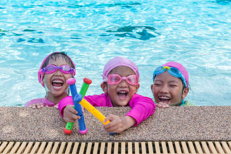 Little asian girls enjoy swimmingの写真素材