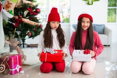Asian girls with gifts box happy Christmas celebrationの写真素材