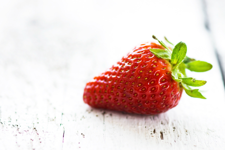 Delicious organic strawberries on a wooden backgroundの写真素材