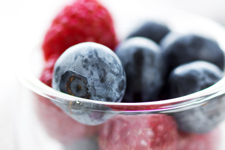 Delicious berries on a wooden backgroundの写真素材