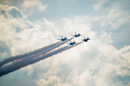 San Antonio, Texas - October, 31: United States Air Force F-16 Thunderbirds approaching above the cloudsのeditorial素材