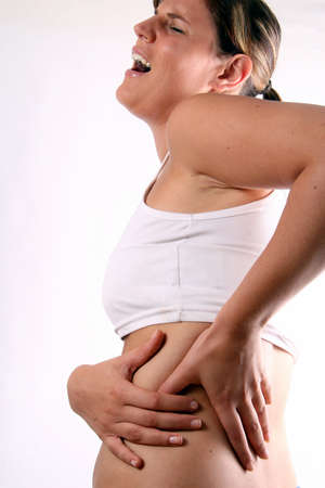 For Crying Out Loud! - A young woman holds her back in pain!