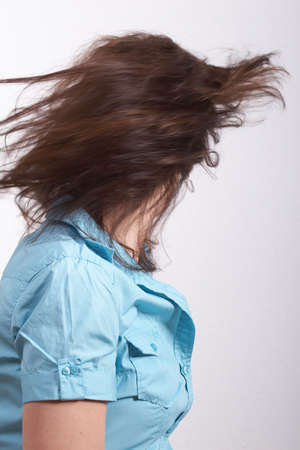Beautiful model moving her amazing brunette hair.の写真素材