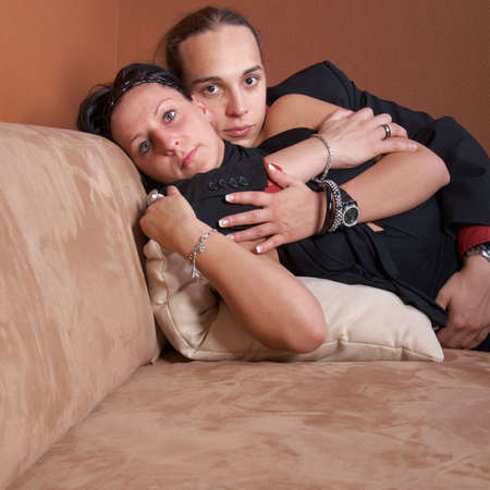 Portrait of a cute young couple enjoying themselves on a couch.