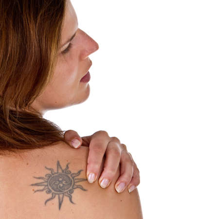 Woman with pain in her neck and shoulder, Isolated medical shot over white background.の写真素材