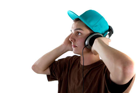 Young fresh teenager with headphones isolated over a white background.