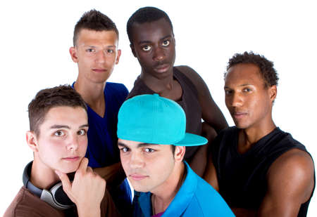 Young group of five teenagers isolated over white. Fresh young men with stylish athletivc outfit.の写真素材