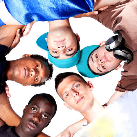 Young group of five teenagers isolated over white. Fresh young men with stylish athletivc outfit.の写真素材