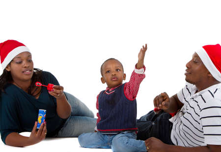 Young black family with a little boy are getting ready for christmas. Happy and cute image.の写真素材