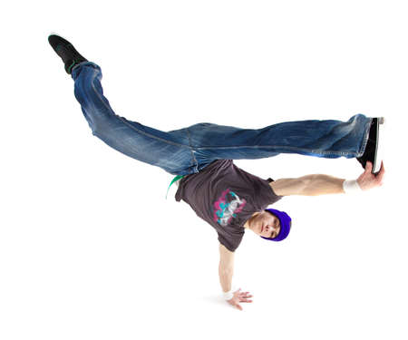 Young handsome fresh man breakdancing with stylish clothes.