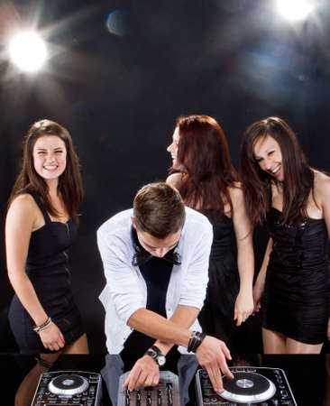 Young people partying to the music from the dj. Candid picture.