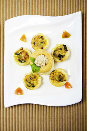 Nice plate with little appetizers nicely decorated. Looking delicious.の写真素材