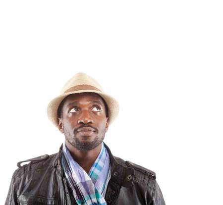 Young man with stylish clothes looking up - isolated over white background.の写真素材