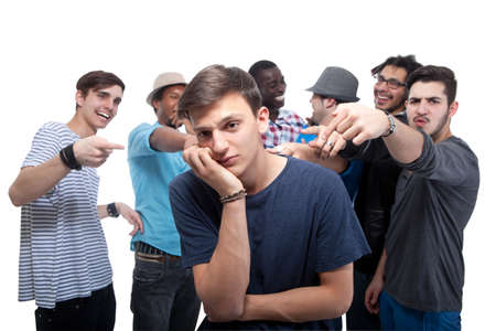 Young Man Blamed By His Friends On White Backgroundの写真素材
