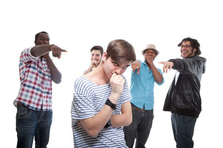 Young Man Blamed By His Friends On White Background
の写真素材