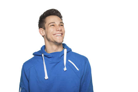 Happy Young Man Smiling Over White Backgroundの写真素材
