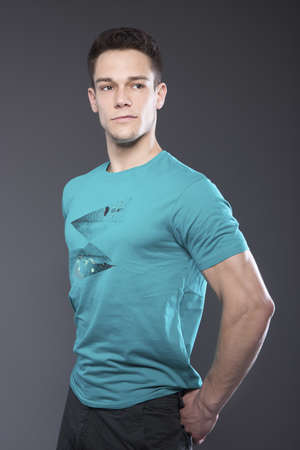 Portrait Of Young Handsome Man Over Gray Backgroundの写真素材