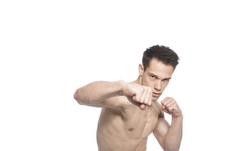 Portrait Of Tough Boxing Guy Punching On White Background