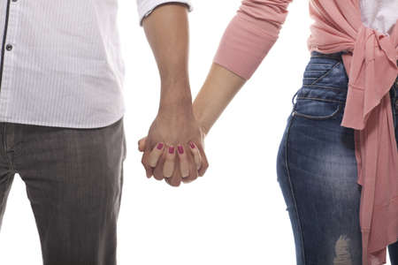 Couple Holding Hands On White Backgroundの写真素材
