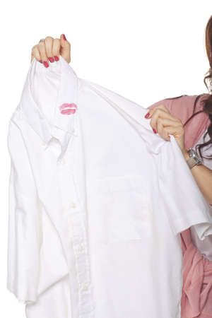 Woman Holding Shirt With Lipstick On White Backgroundの写真素材