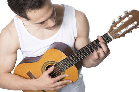 Young Man Playing Guitar Over White Backgroundの写真素材