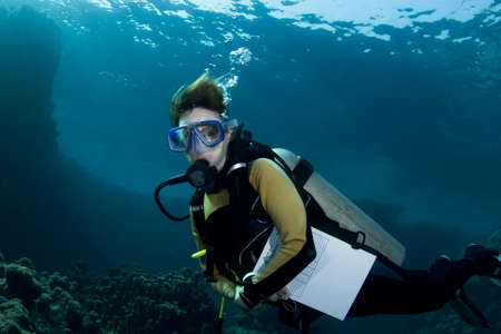 Female scuba diver during an advanced open water course in the Southern Red Seaの写真素材