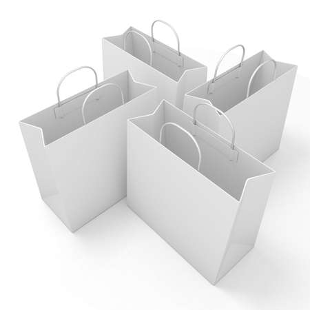 Empty paper bags, arranged and isolated on white. Side viewの写真素材