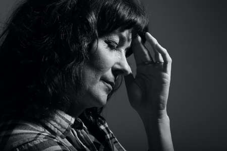 Portrait of a beautiful happy woman in front of a colored backgroundの写真素材