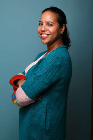 Portrait of a beautiful happy woman in front of a colored backgroundの写真素材