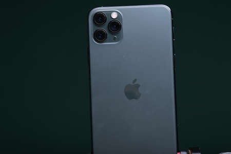 Zwolle, Nederland - October 22, 2019, Customer holding the Iphone 11 Max Pro (midnight green) in their hand.のeditorial素材