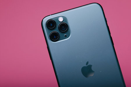 Zwolle, Nederland - October 22, 2019, Customer holding the Iphone 11 Max Pro (midnight green) in their hand.のeditorial素材