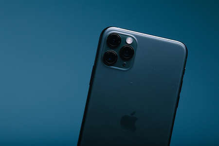 Zwolle, Nederland - October 22, 2019, Customer holding the Iphone 11 Max Pro (midnight green) in their hand.のeditorial素材
