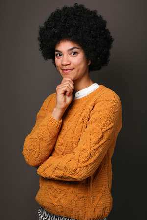 Portrait of a beautiful happy woman in front of a colored backgroundの写真素材