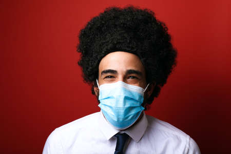 Beautiful man wearing a mouth maskの写真素材