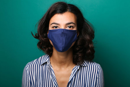 Beautiful woman wearing a mouth maskの写真素材