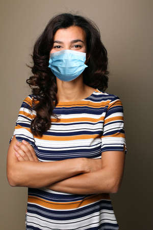 Beautiful woman wearing a mouth maskの写真素材