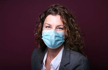 Beautiful woman wearing a mouth maskの写真素材