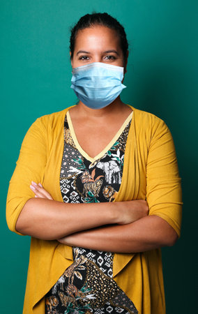 Beautiful woman wearing a mouth maskの写真素材