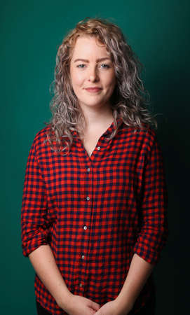 Portrait of a beautiful happy woman in front of a colored backgroundの写真素材
