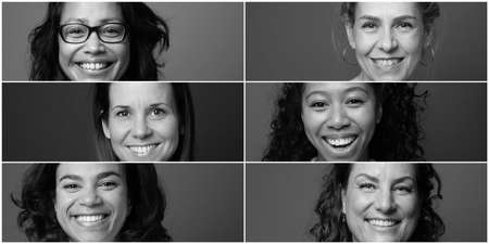 Beautiful happy people in front of a backgroundの写真素材