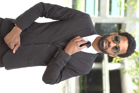 Beautiful businessman outside in the summerの写真素材